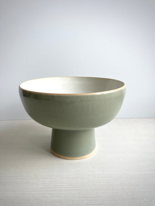 A green & white pedestal bowl