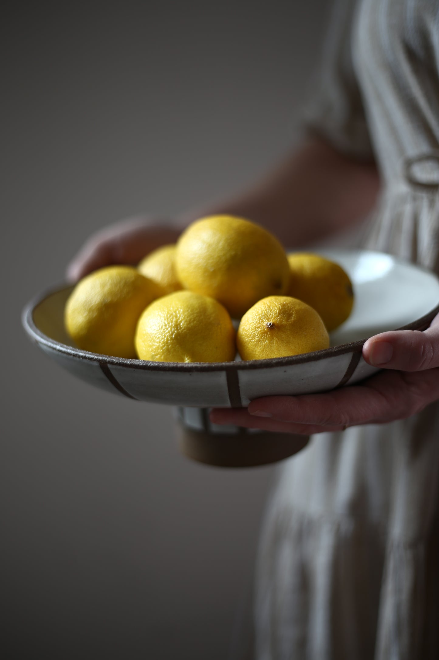 Striped pedestal serving bowl